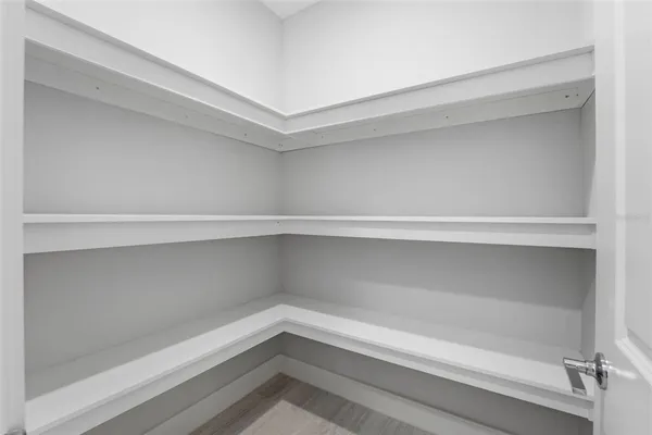 a view of an empty walk in closet
