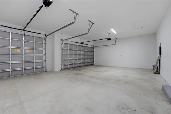 a view of empty room with white walls