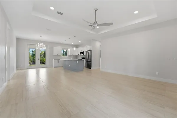 a view of a kitchen with a sink and a refrigerator