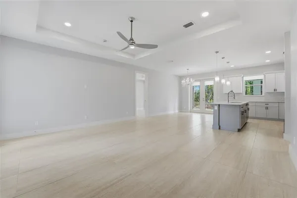a view of a kitchen with a sink and a window