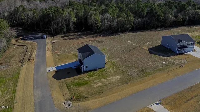 a view of a backyard of the house