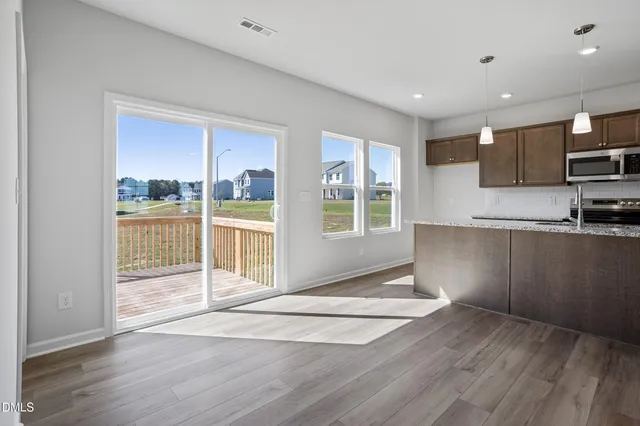 a kitchen with granite countertop a sink and window