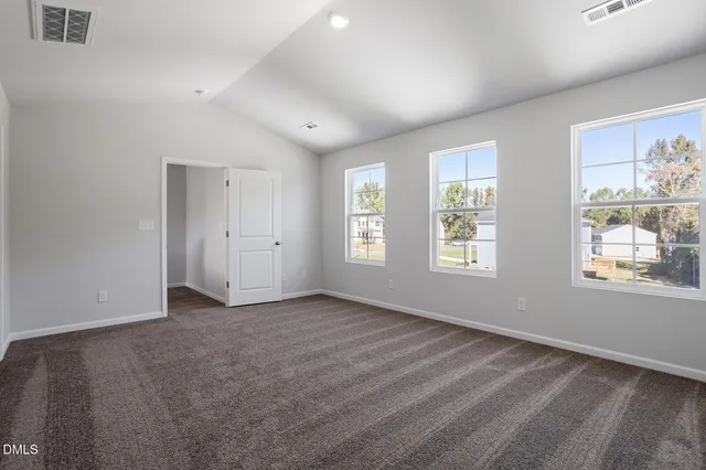 a view of an empty room and a room