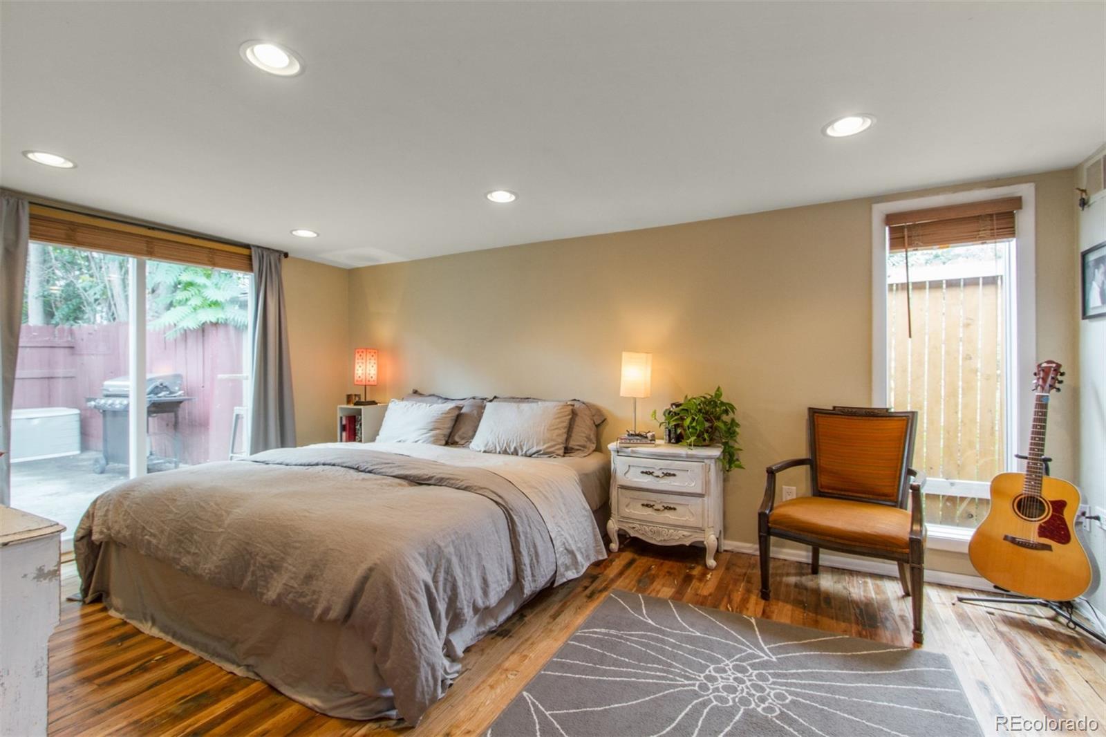 3705 Zuni Street Denver, CO 80211 - Photo 11 of 15 a spacious bedroom with a bed and wooden floor