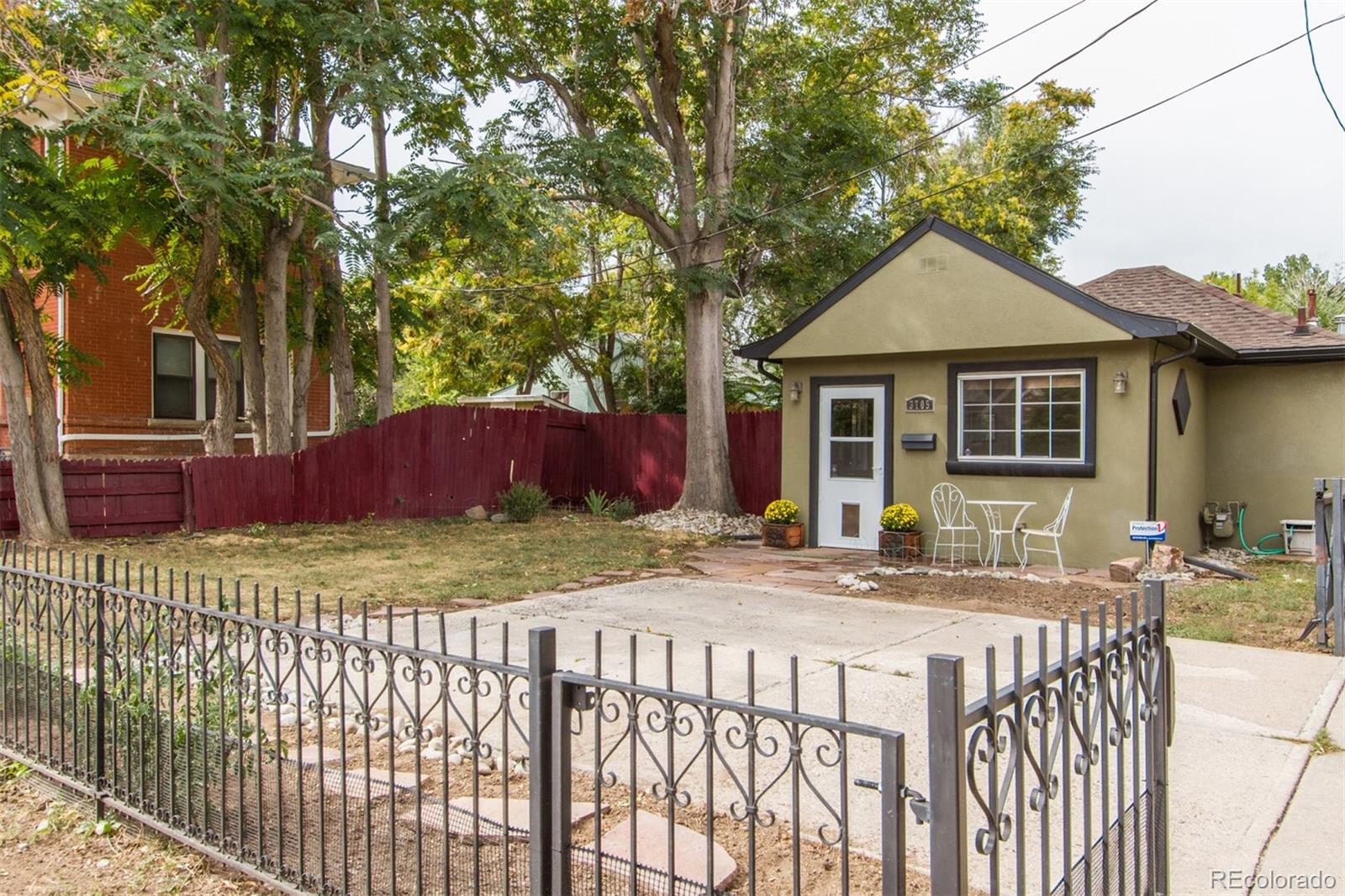 3705 Zuni Street Denver, CO 80211 - Photo 2 of 15 a view of a house with wooden fence