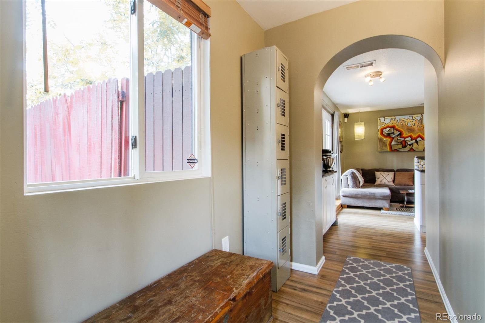 3705 Zuni Street Denver, CO 80211 - Photo 3 of 15 a bedroom with a bed and a window