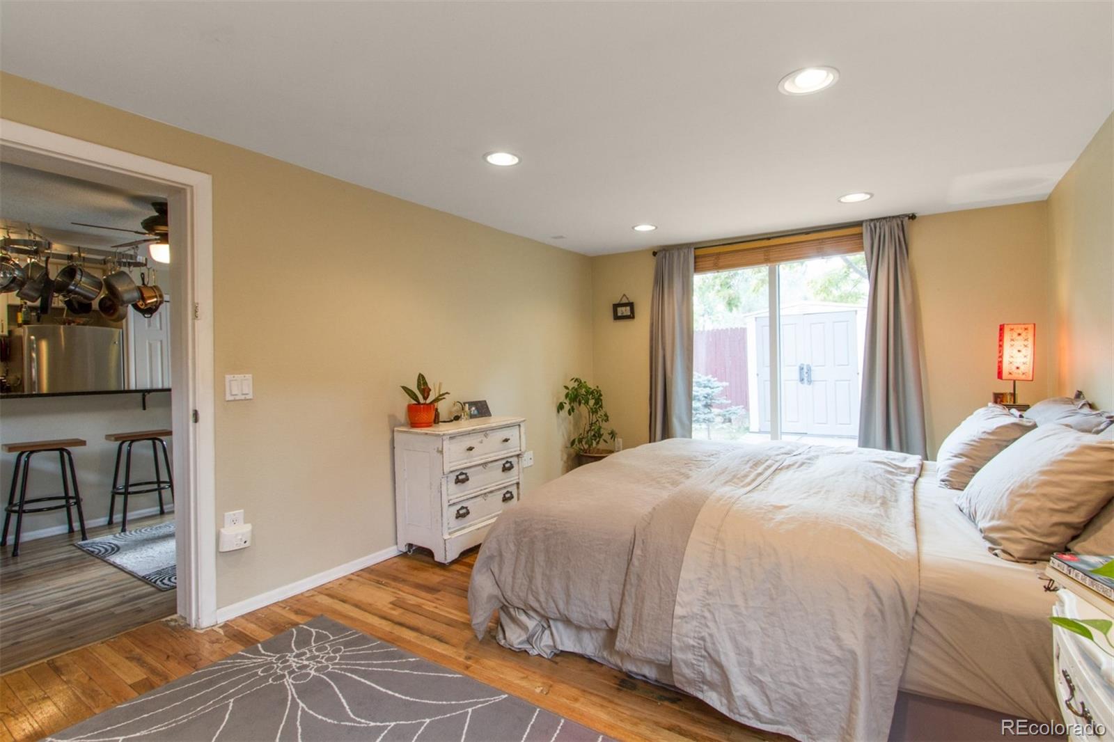 3705 Zuni Street Denver, CO 80211 - Photo 10 of 15 a bedroom with a bed and a window