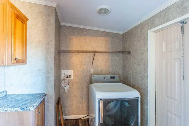a view of a room with a window and a ceiling fan