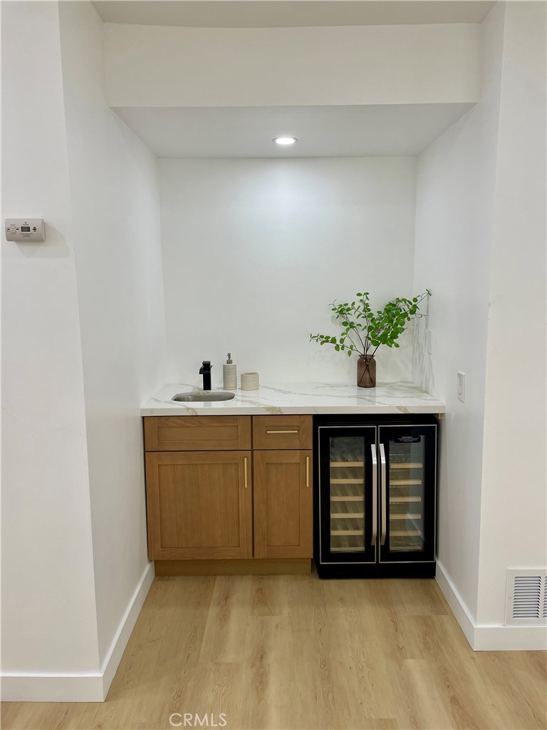 339 Winslow Avenue Long Beach, CA 90814 - Photo 12 of 50 Wet bar off of dining room. Bev frig included.