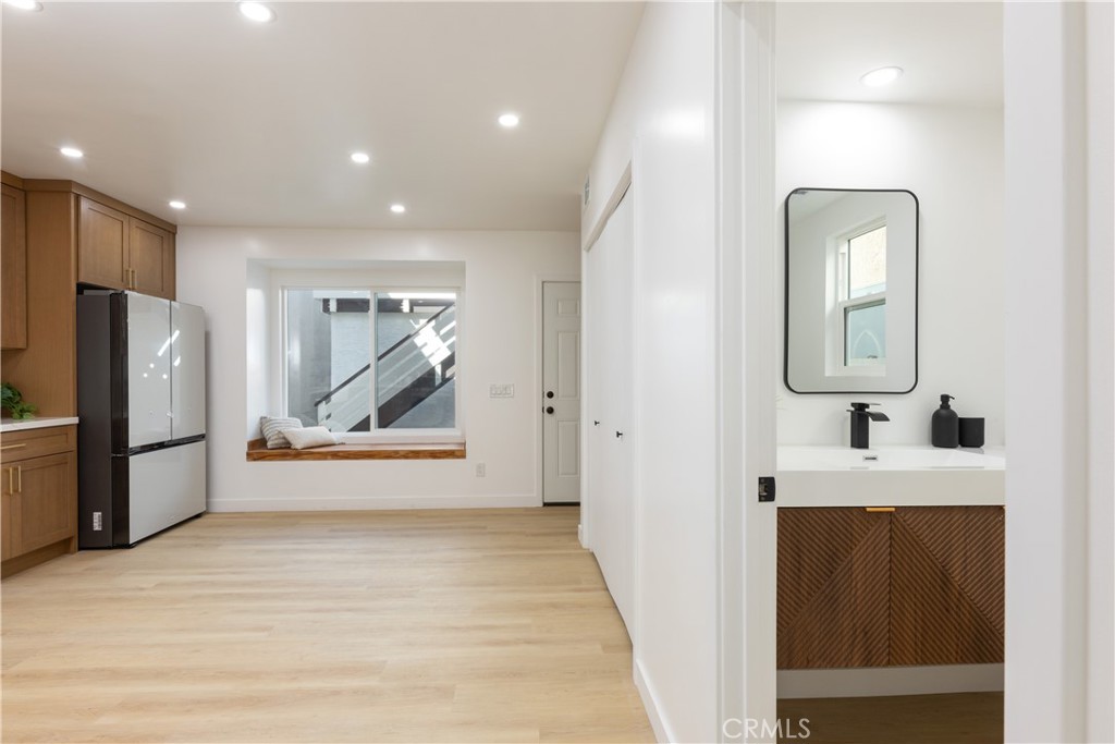 339 Winslow Avenue Long Beach, CA 90814 - Photo 13 of 50 Entering kitchen with powder room to right