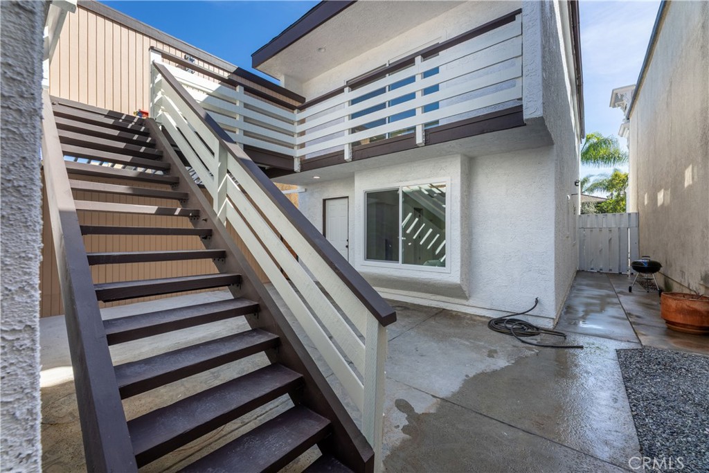 339 Winslow Avenue Long Beach, CA 90814 - Photo 40 of 50 Stairs to upper deck from rear patio