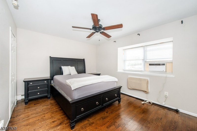 25 River Road, Unit A14 Nutley, NJ 07110 - Photo 14 of 21 a bedroom with a bed and window