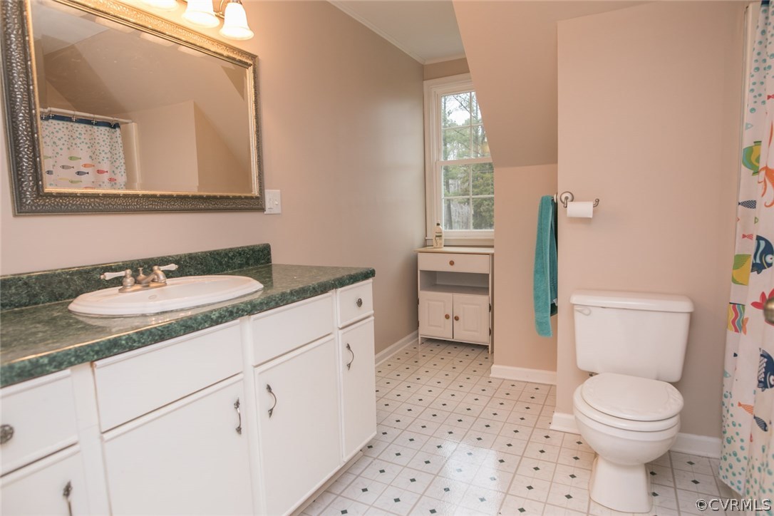 11631 Beach Road Chesterfield, VA 23838 - Photo 14 of 49 a bathroom with a sink toilet vanity and tub