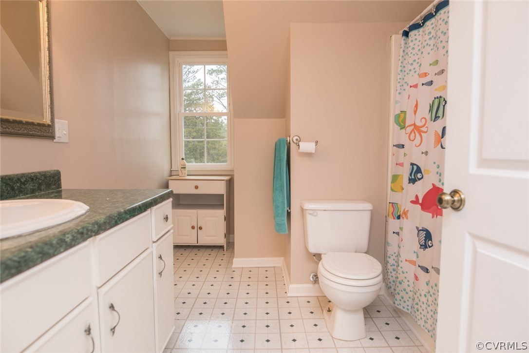 11631 Beach Road Chesterfield, VA 23838 - Photo 15 of 49 a bathroom with a granite countertop toilet a sink and a shower curtain