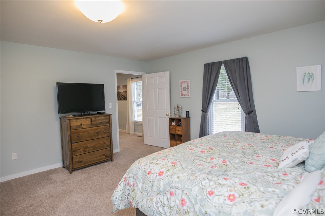 11631 Beach Road Chesterfield, VA 23838 - Photo 25 of 49 a bedroom with a bed and a flat screen tv
