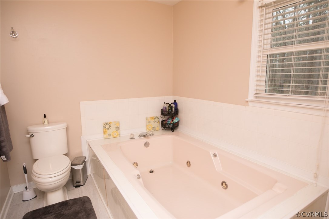 11631 Beach Road Chesterfield, VA 23838 - Photo 28 of 49 a bathroom with a bathtub and a toilet