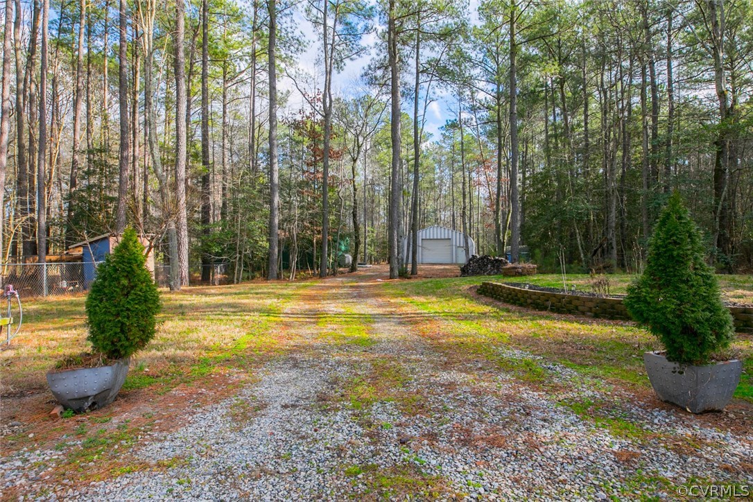11631 Beach Road Chesterfield, VA 23838 - Photo 45 of 49 a view of a swimming pool with a yard and plants