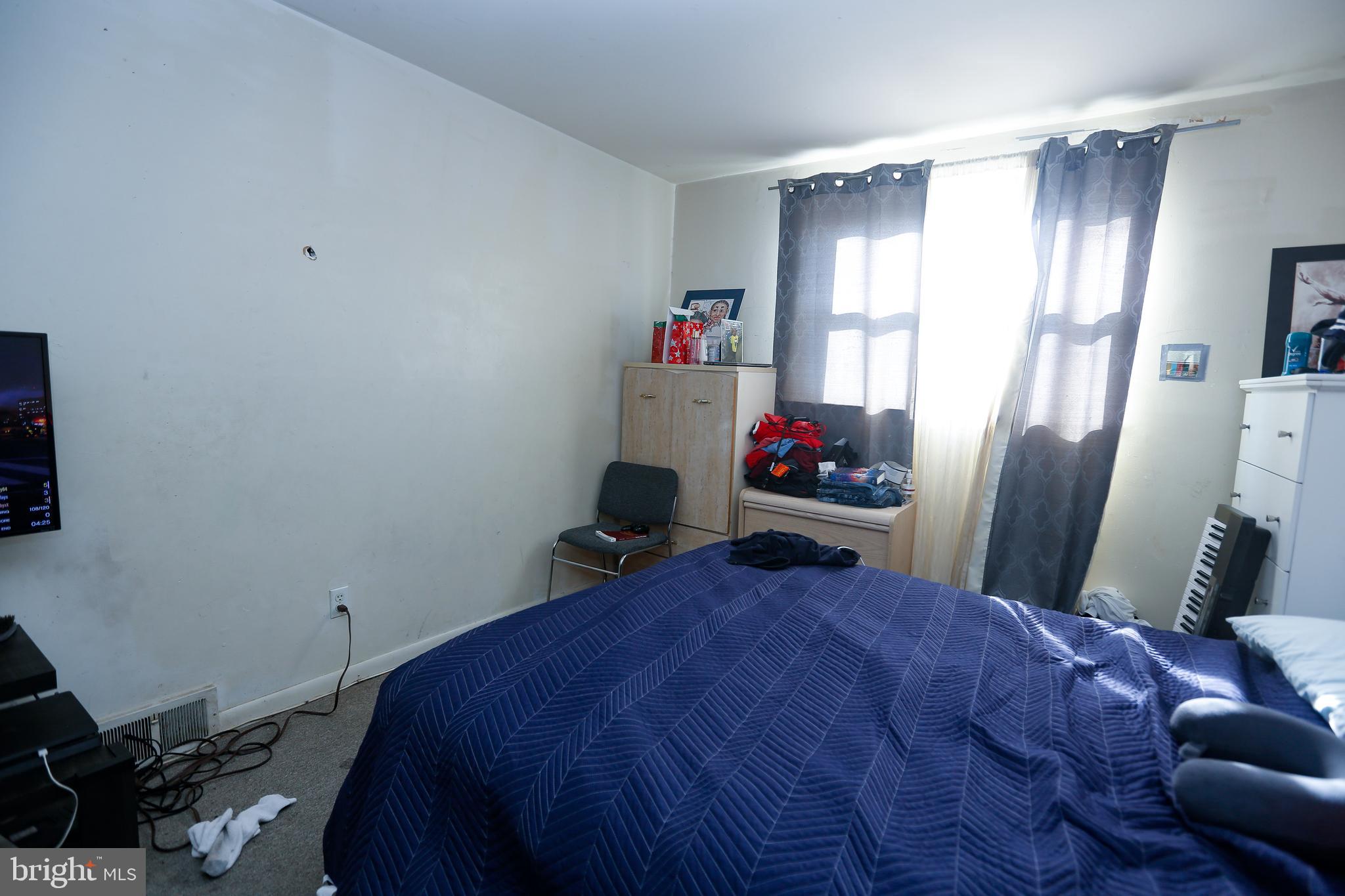 2638 Daphne Road Philadelphia, PA 19131 - Photo 22 of 30 a bedroom with a bed and a window