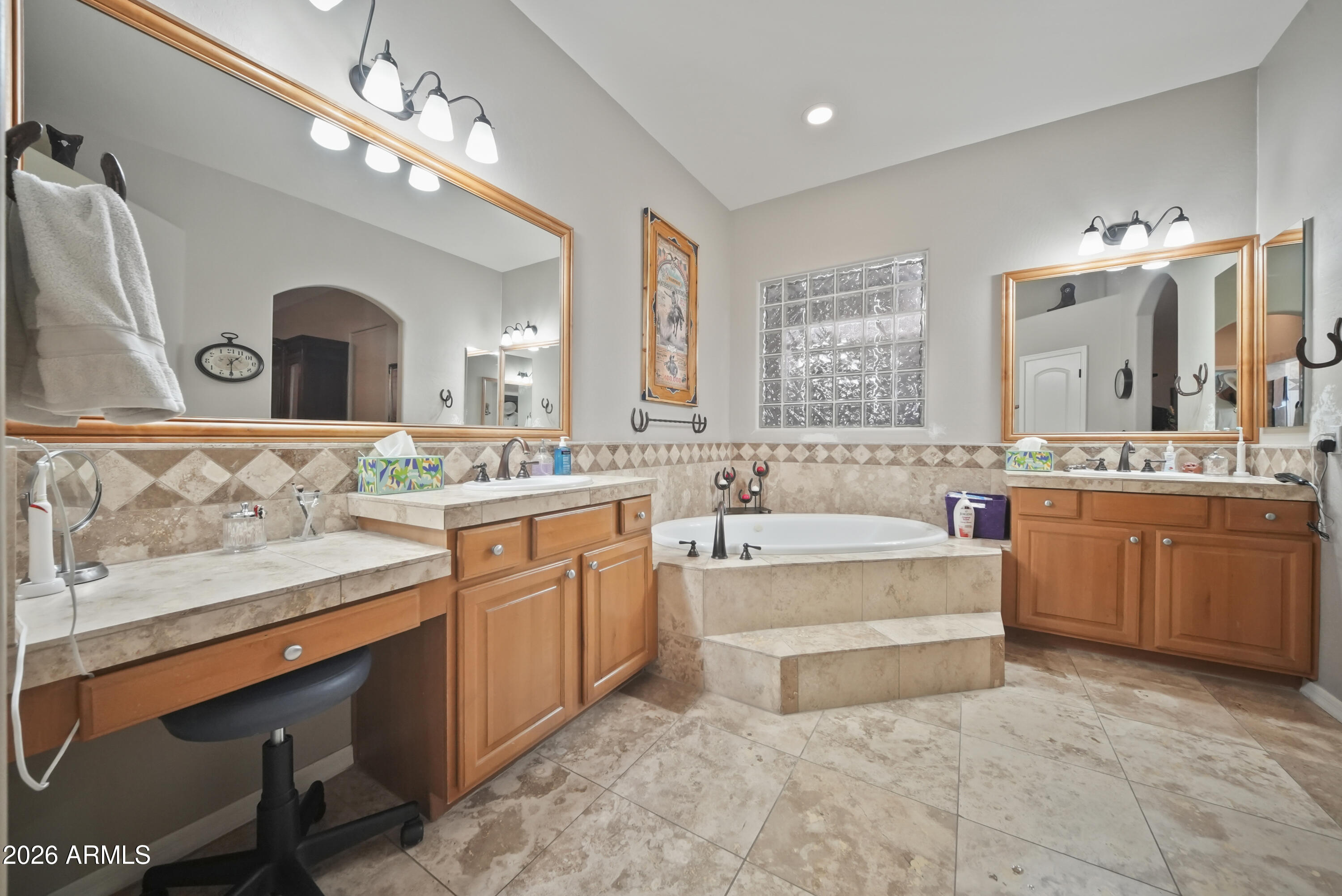 605 West Ridgecrest Road Phoenix, AZ 85086 - Photo 26 of 40 a spacious en suite bathroom with a double vanity sink a mirror a bathtub and a window