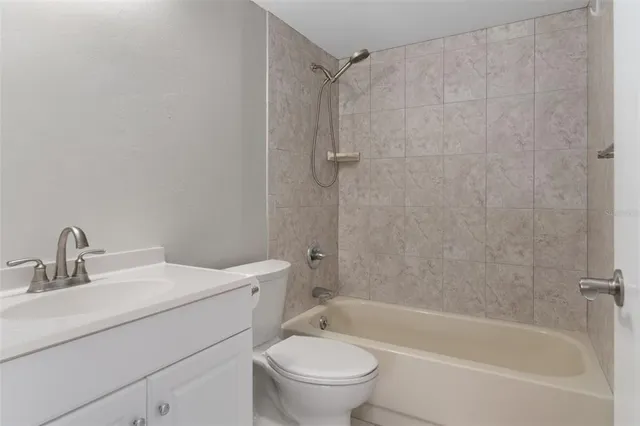 a view of bathroom with a toilet a sink and a bathroom