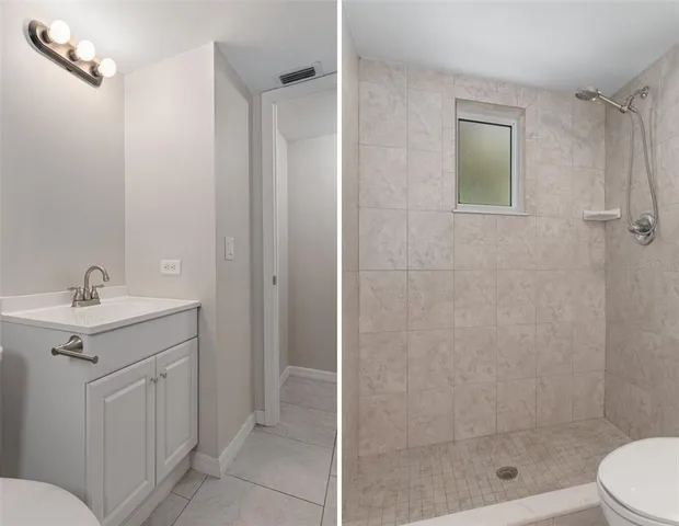 a bathroom with a toilet and shower