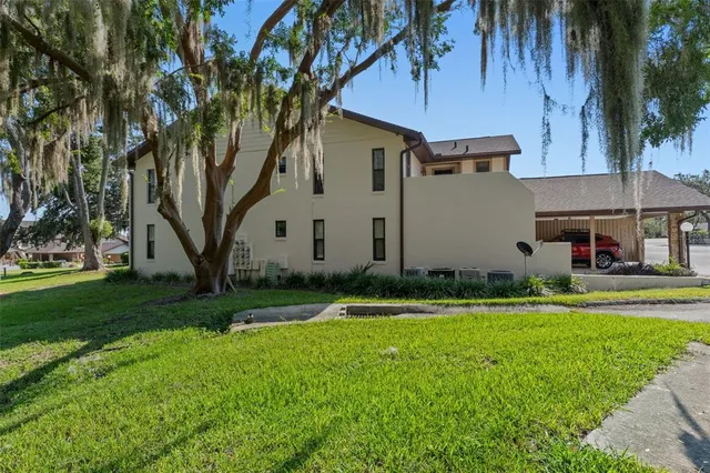 an aerial view of a house with outdoor space
