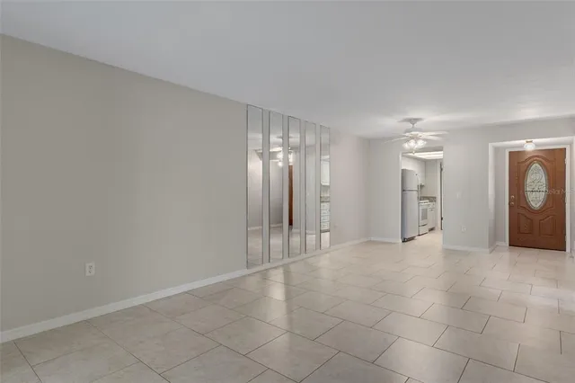 a view of an empty room with a fireplace