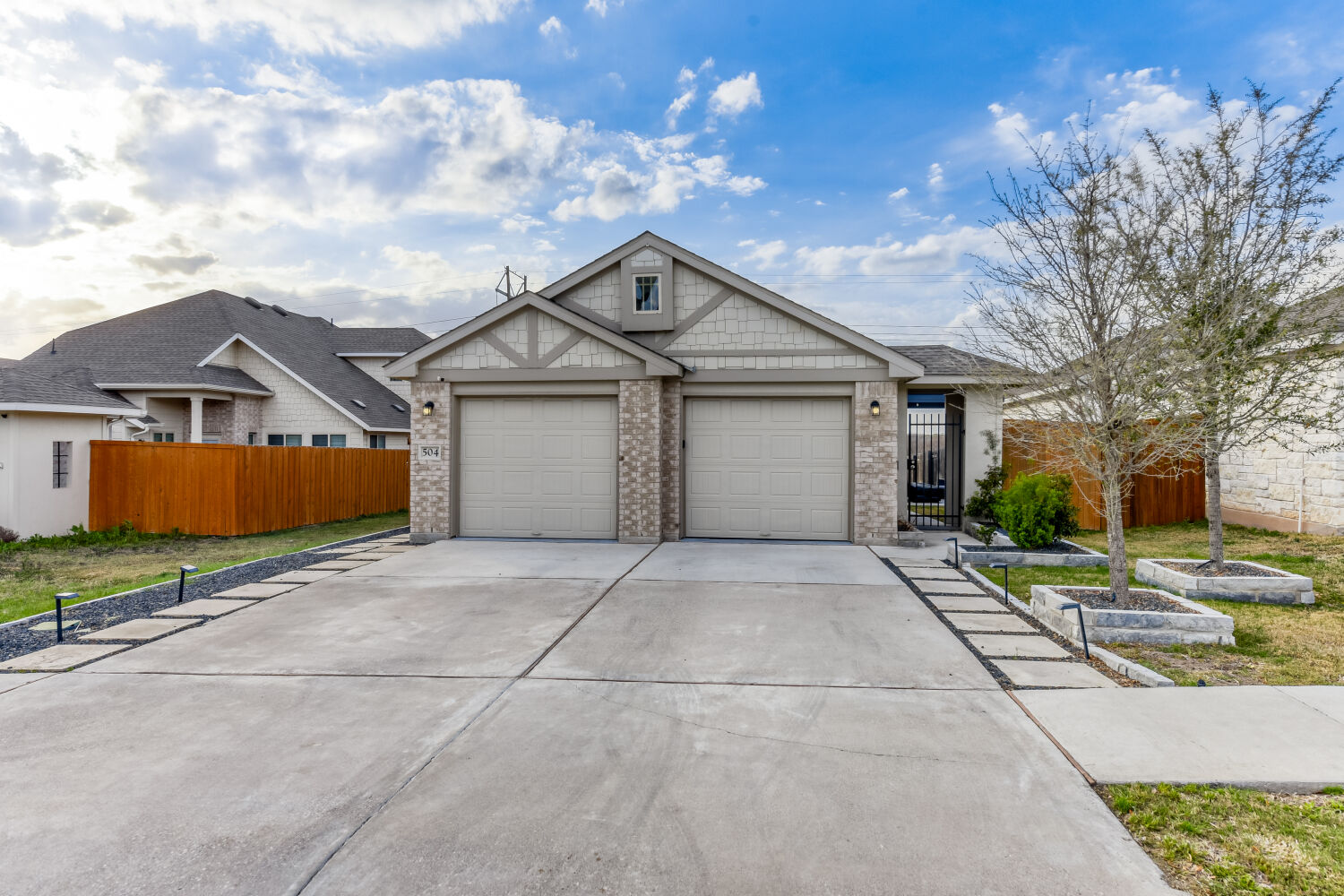 504 Spinnaker Loop Kyle, TX 78640 - Photo 1 of 1 View of front of property featuring brick siding, concrete driveway, and an attached garage
