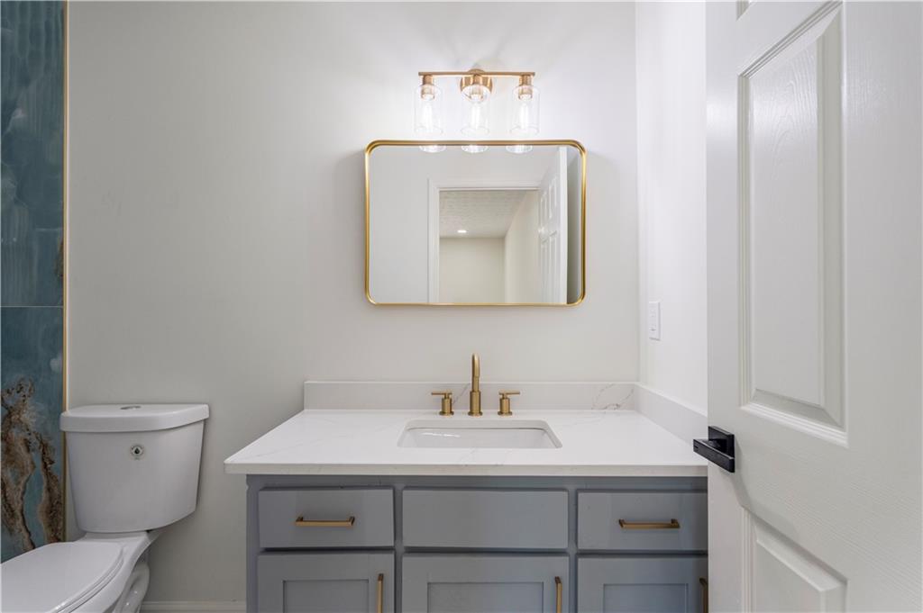 766 Lee Road Phenix City, AL 36870 - Photo 14 of 30 Bathroom featuring vanity and toilet