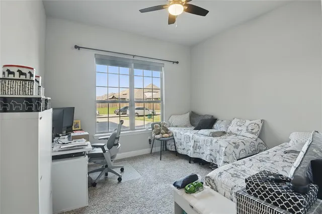 a bedroom with furniture and a window
