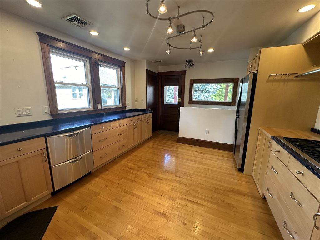 17 Herbert Road, Unit 1 Arlington, MA 02474 - Photo 2 of 26 a view of an empty room with window and wooden floor