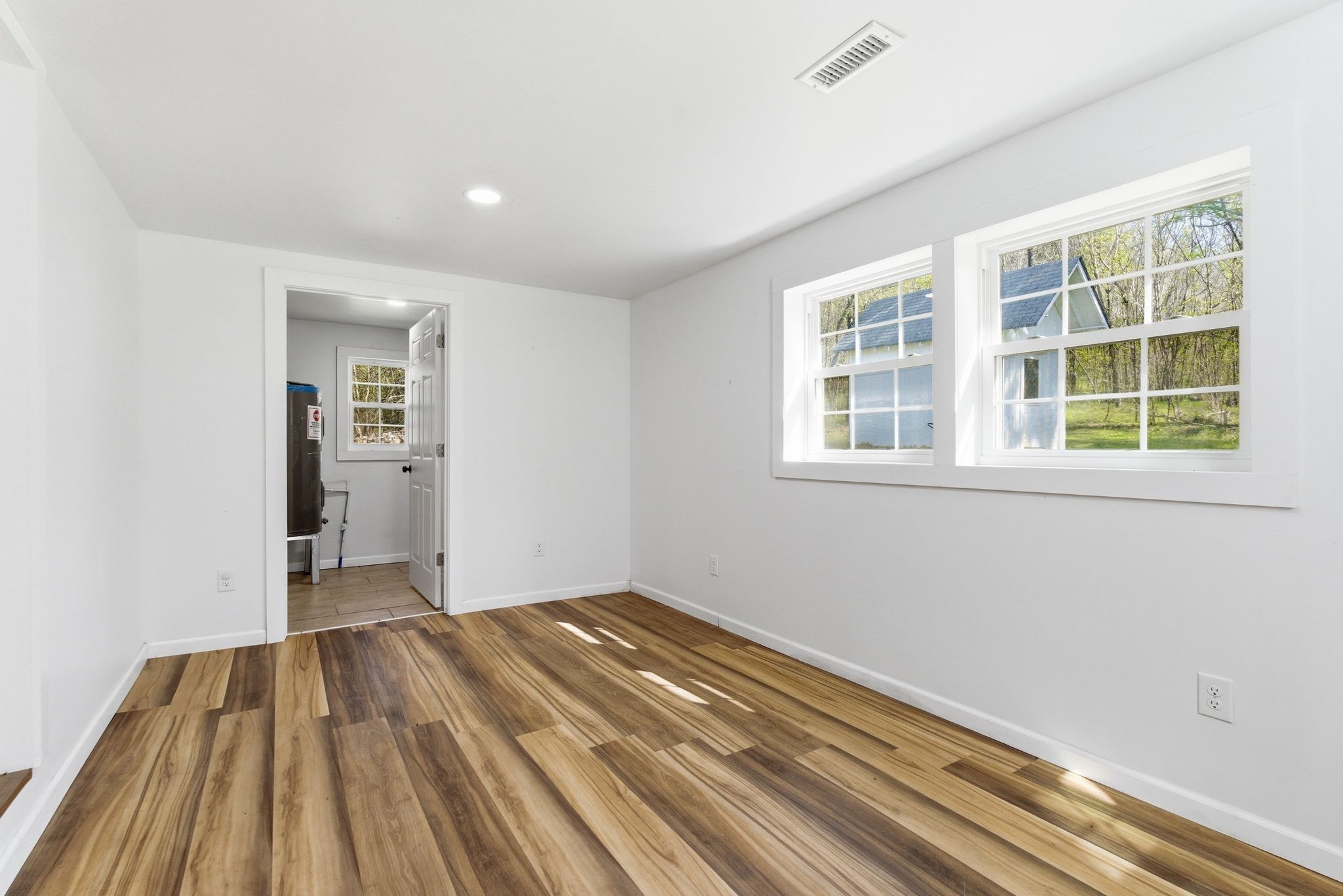 2635 McBrides Branch Road Beechgrove, TN 37018 - Photo 11 of 48 a view of a room with wooden floor and windows