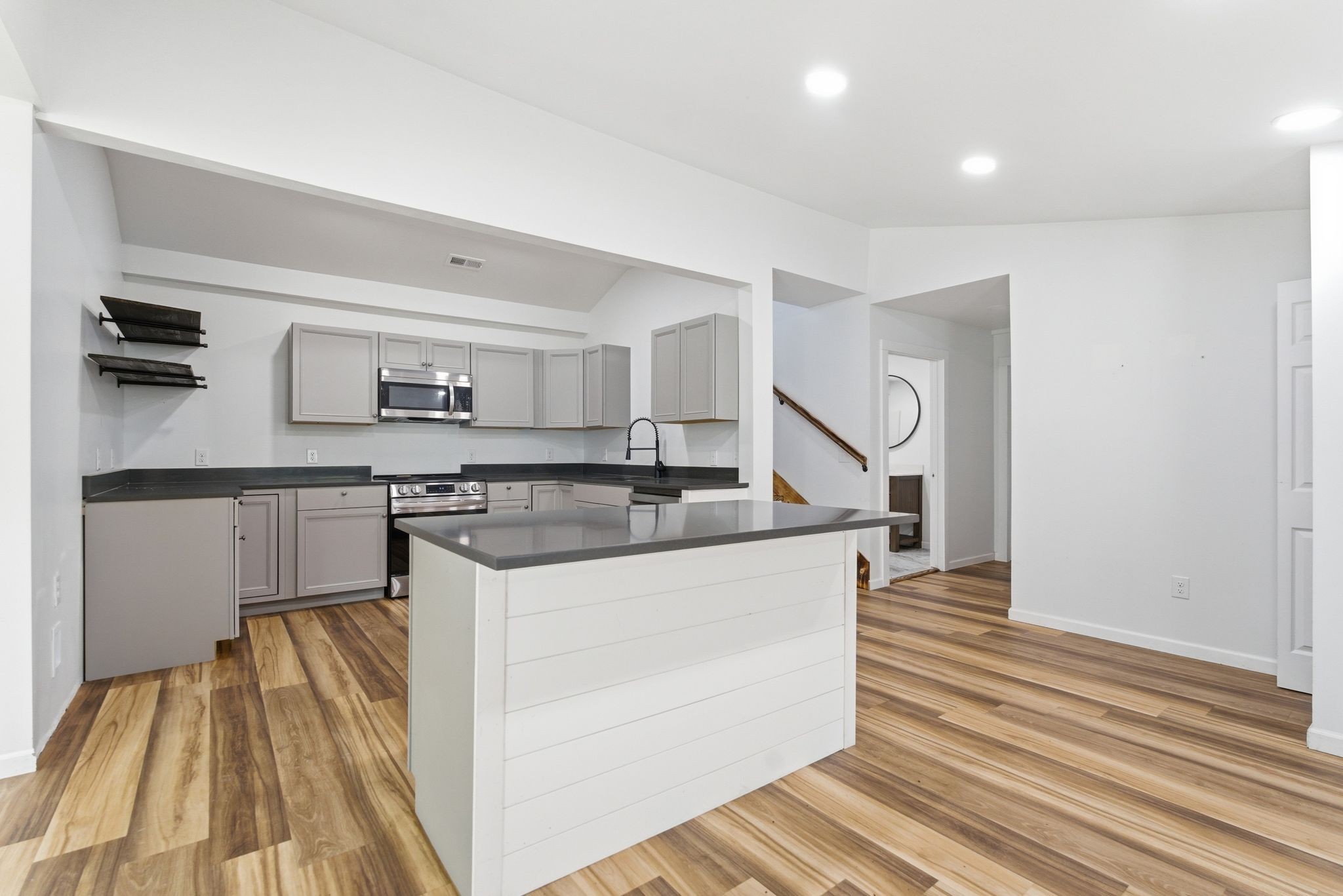 2635 McBrides Branch Road Beechgrove, TN 37018 - Photo 14 of 48 a kitchen with stainless steel appliances granite countertop a refrigerator and a stove top oven