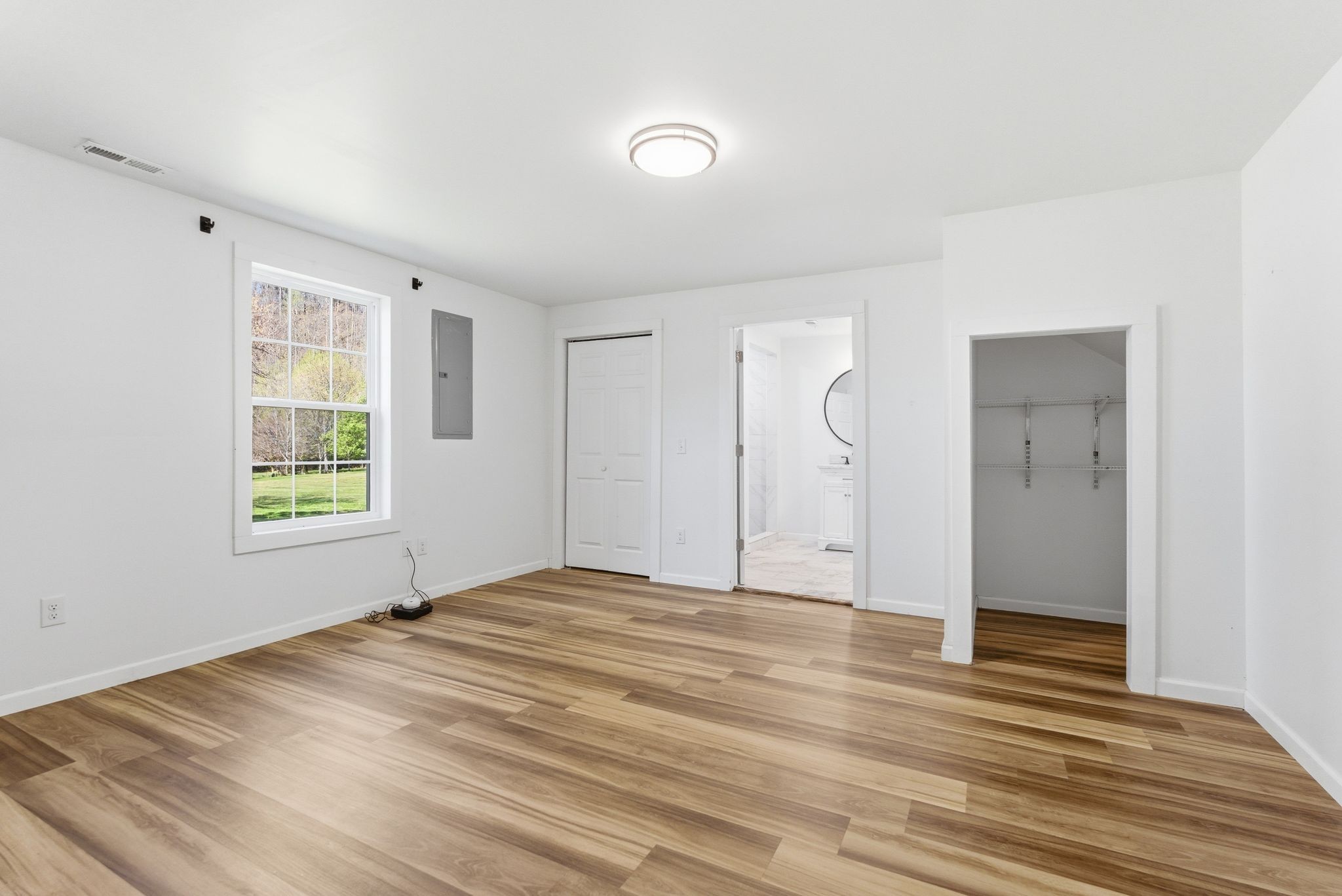 2635 McBrides Branch Road Beechgrove, TN 37018 - Photo 21 of 48 a view of an empty room with wooden floor and a window