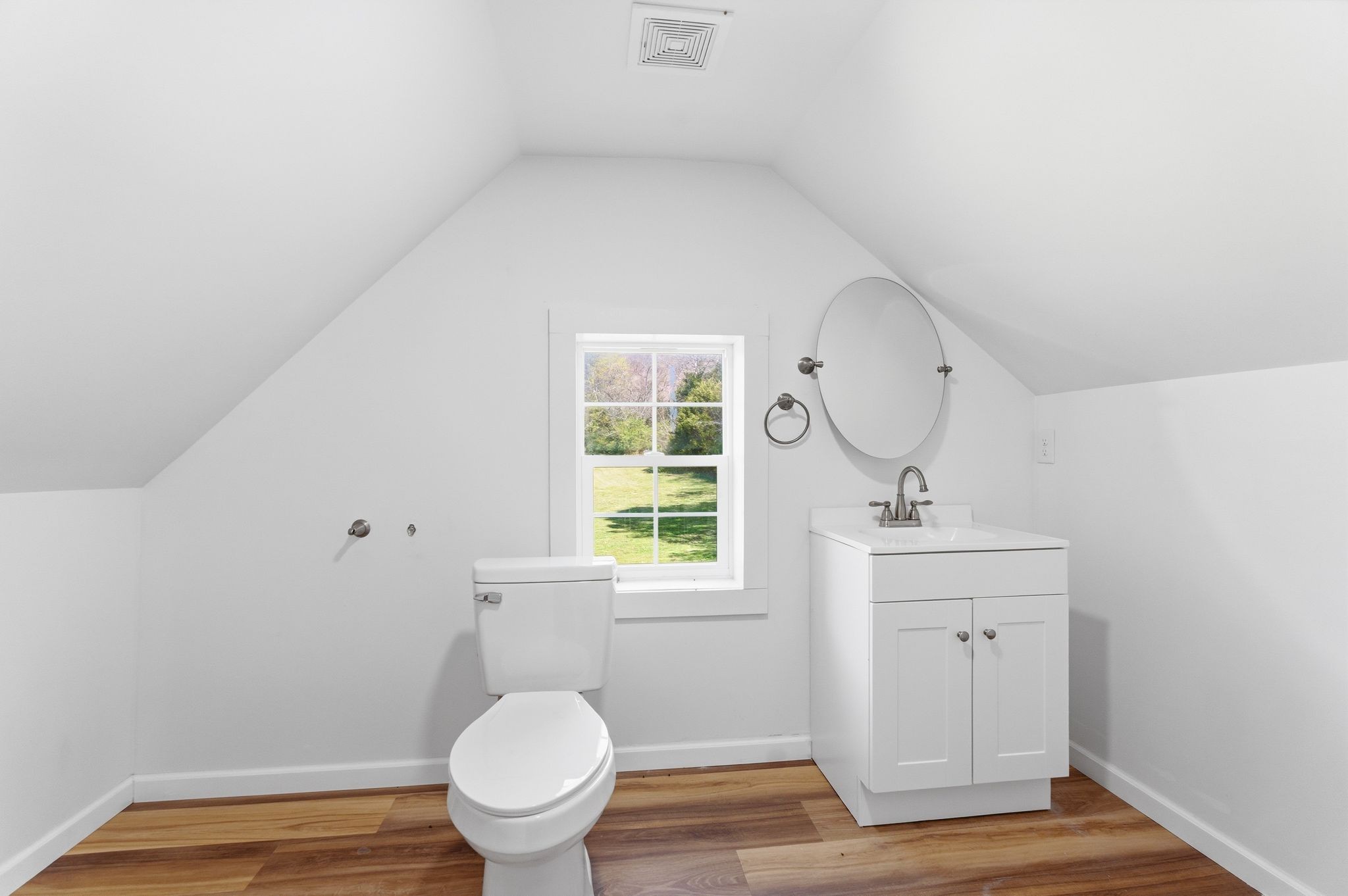 2635 McBrides Branch Road Beechgrove, TN 37018 - Photo 34 of 48 a bathroom with a toilet a sink and mirror