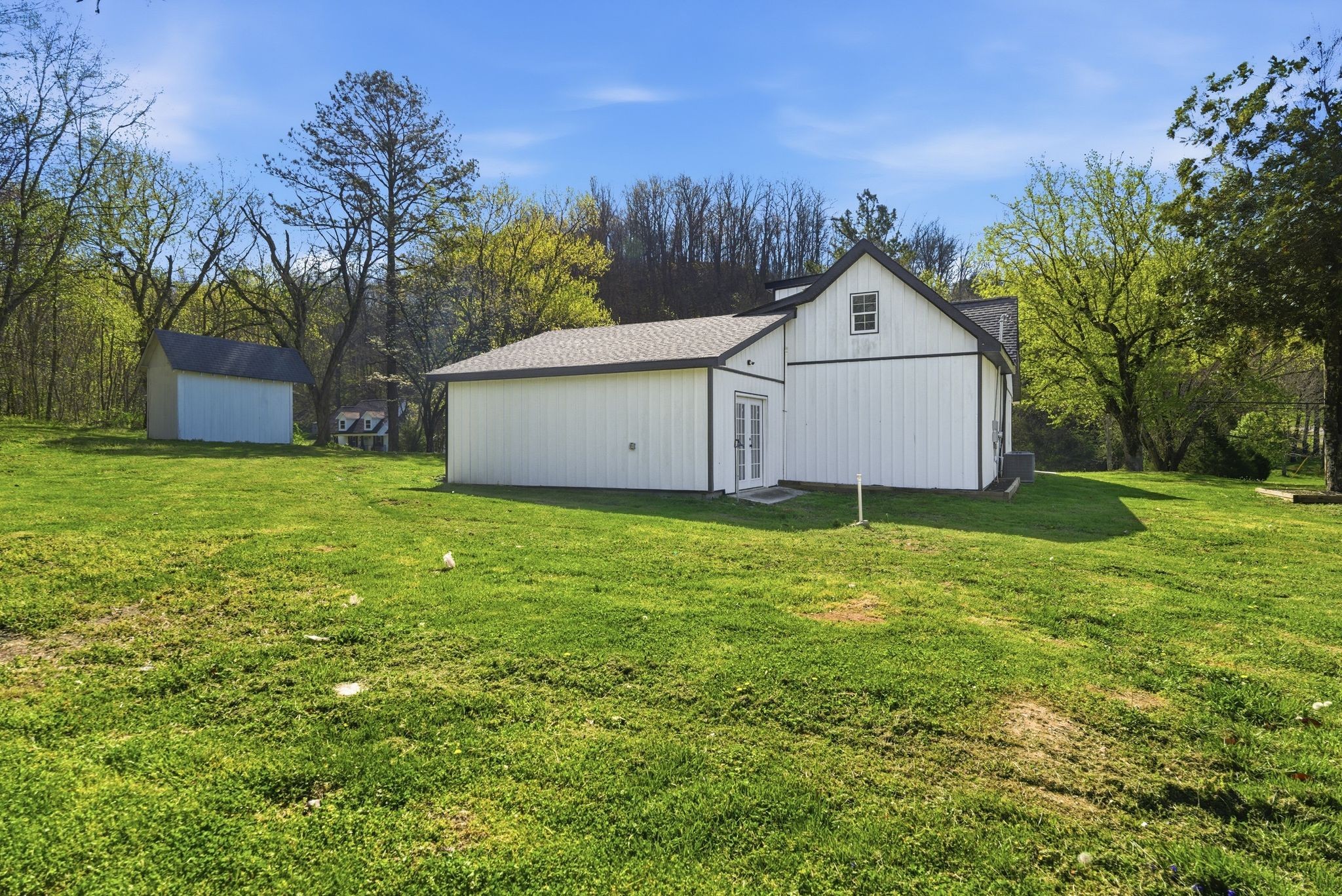 2635 McBrides Branch Road Beechgrove, TN 37018 - Photo 37 of 48 a house with green field in front of it