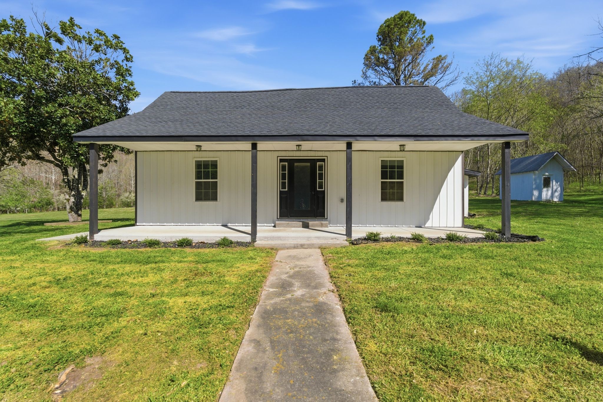 2635 McBrides Branch Road Beechgrove, TN 37018 - Photo 4 of 48 front view of a house with a yard