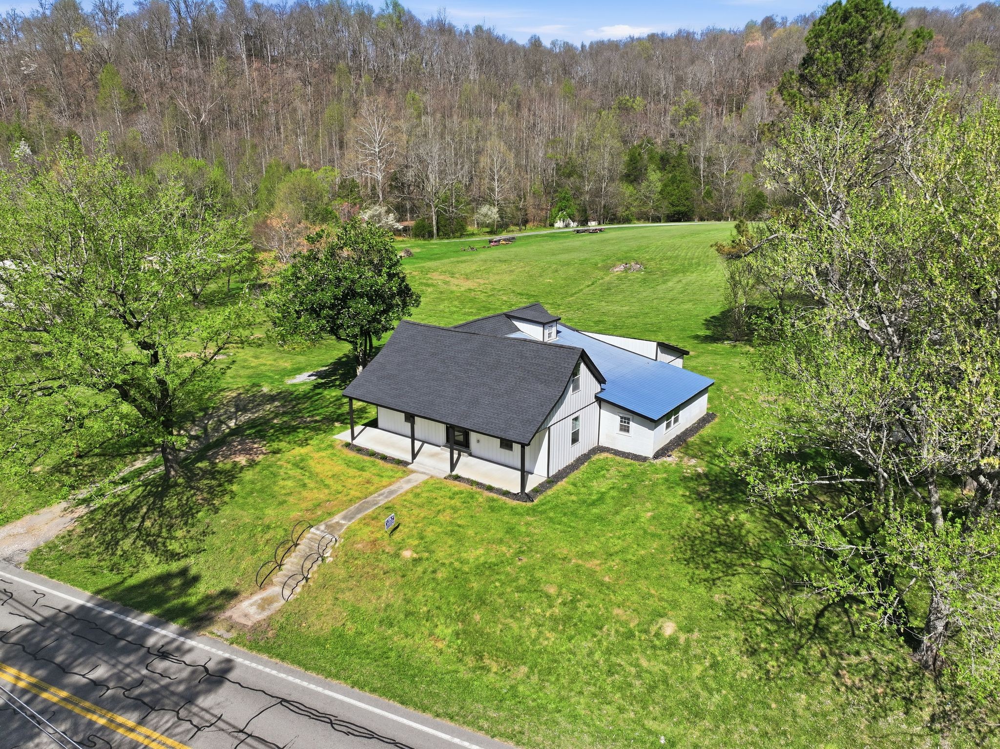 2635 McBrides Branch Road Beechgrove, TN 37018 - Photo 42 of 48 a yard with trees in the background