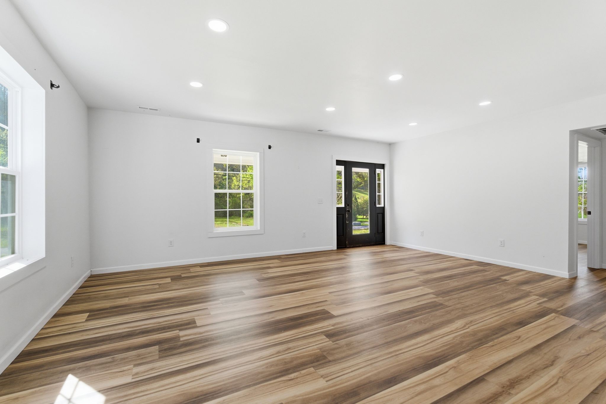 2635 McBrides Branch Road Beechgrove, TN 37018 - Photo 8 of 48 a view of an empty room with wooden floor and a window
