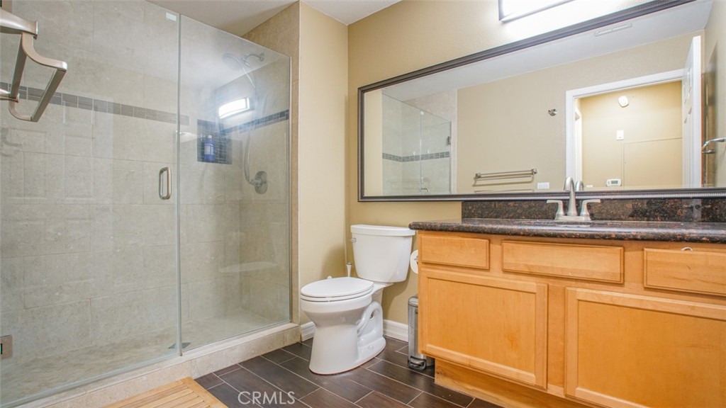 375 Central Avenue, Unit 153 Riverside, CA 92507 - Photo 24 of 24 a bathroom with a sink a toilet and shower