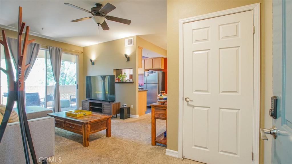 375 Central Avenue, Unit 153 Riverside, CA 92507 - Photo 6 of 24 a living room with furniture and a window