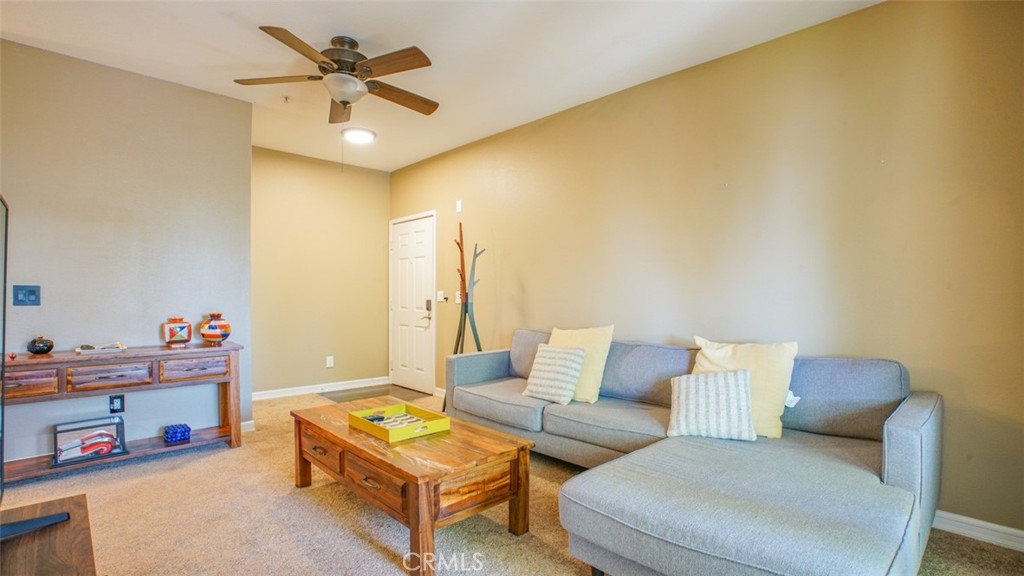375 Central Avenue, Unit 153 Riverside, CA 92507 - Photo 7 of 24 a living room with furniture and a chandelier