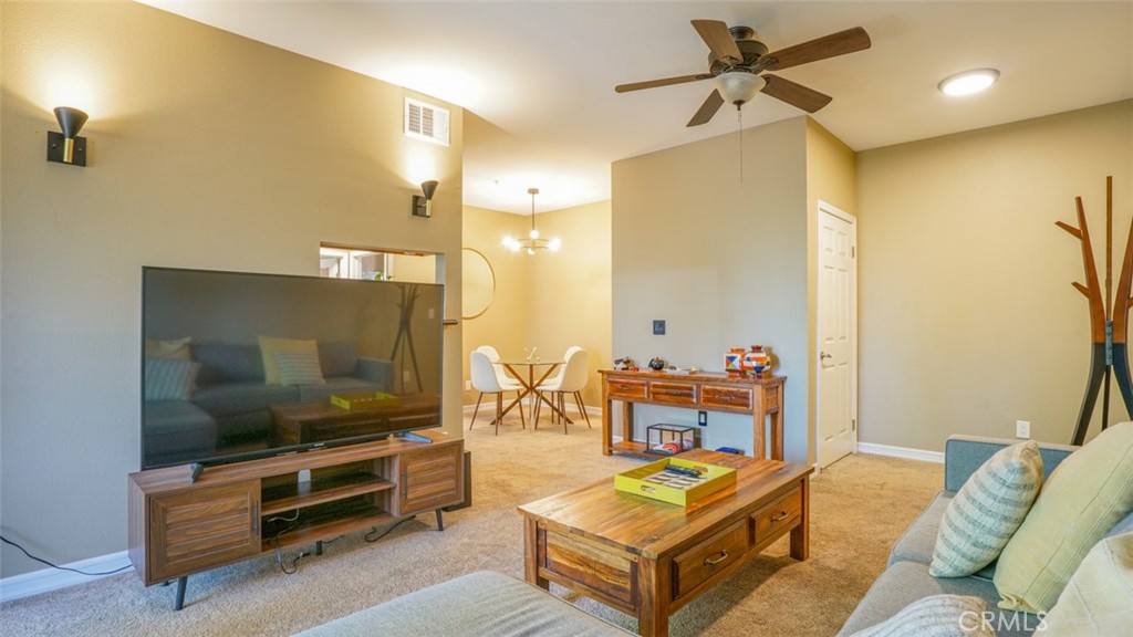375 Central Avenue, Unit 153 Riverside, CA 92507 - Photo 8 of 24 a living room with furniture and a flat screen tv