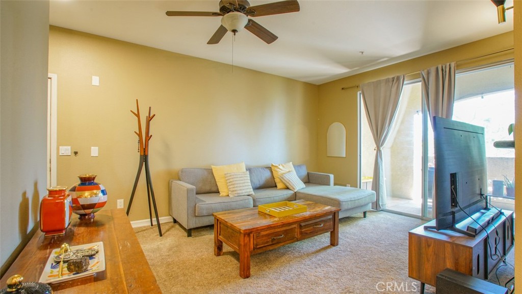 375 Central Avenue, Unit 153 Riverside, CA 92507 - Photo 9 of 24 a living room with furniture and a window