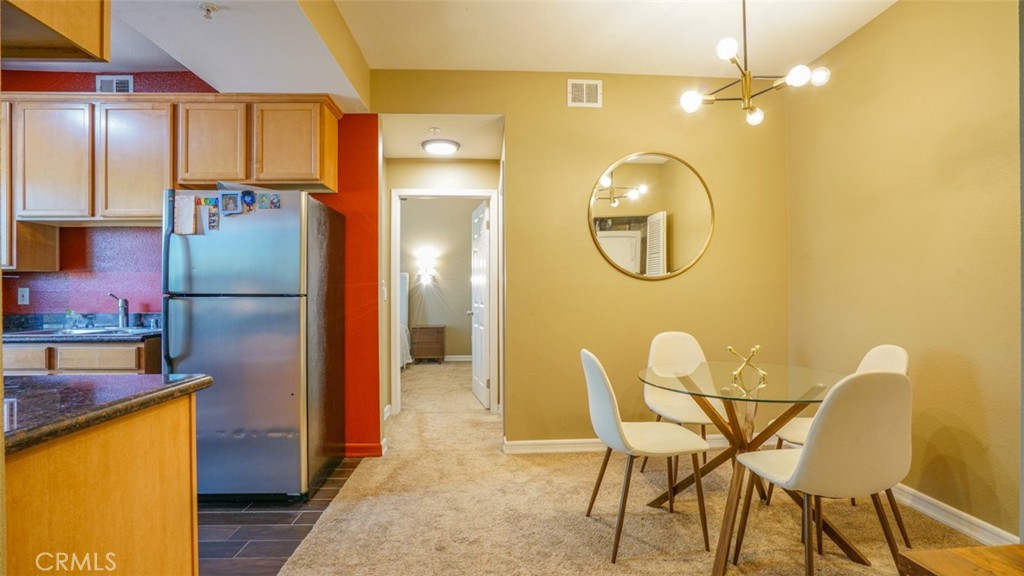 375 Central Avenue, Unit 153 Riverside, CA 92507 - Photo 10 of 24 a kitchen with a refrigerator and countertop