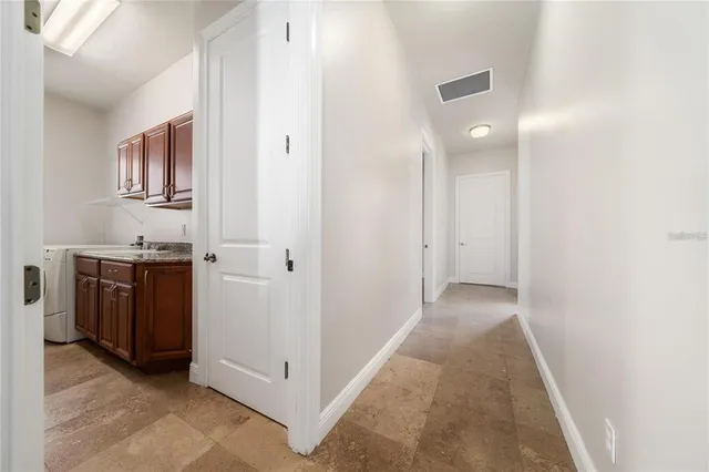 a utility room with window washer and dryer