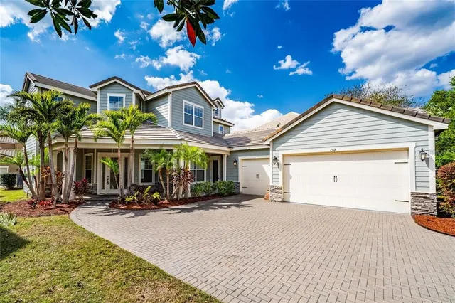 a view of a house with many windows and a table
