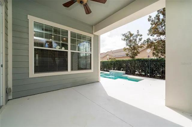 a view of potted plants in front of a building