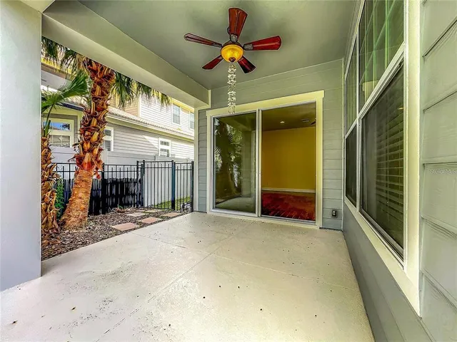 a view of a bench in patio with a garden