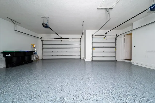 a view of a patio with swimming pool table and chairs